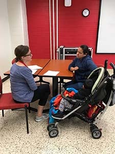 Ellyn McNamara, Disability Studies IL LEND Trainee, screening a child for ASD.